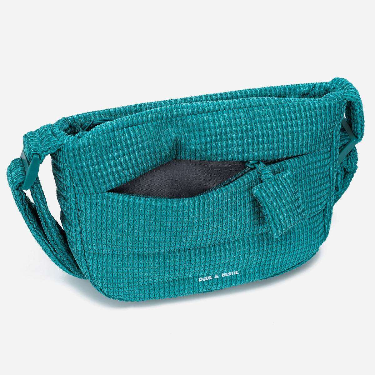 A teal color woven Corduroy Puff shoulder bag by Dude & Bestie Winter 2026
