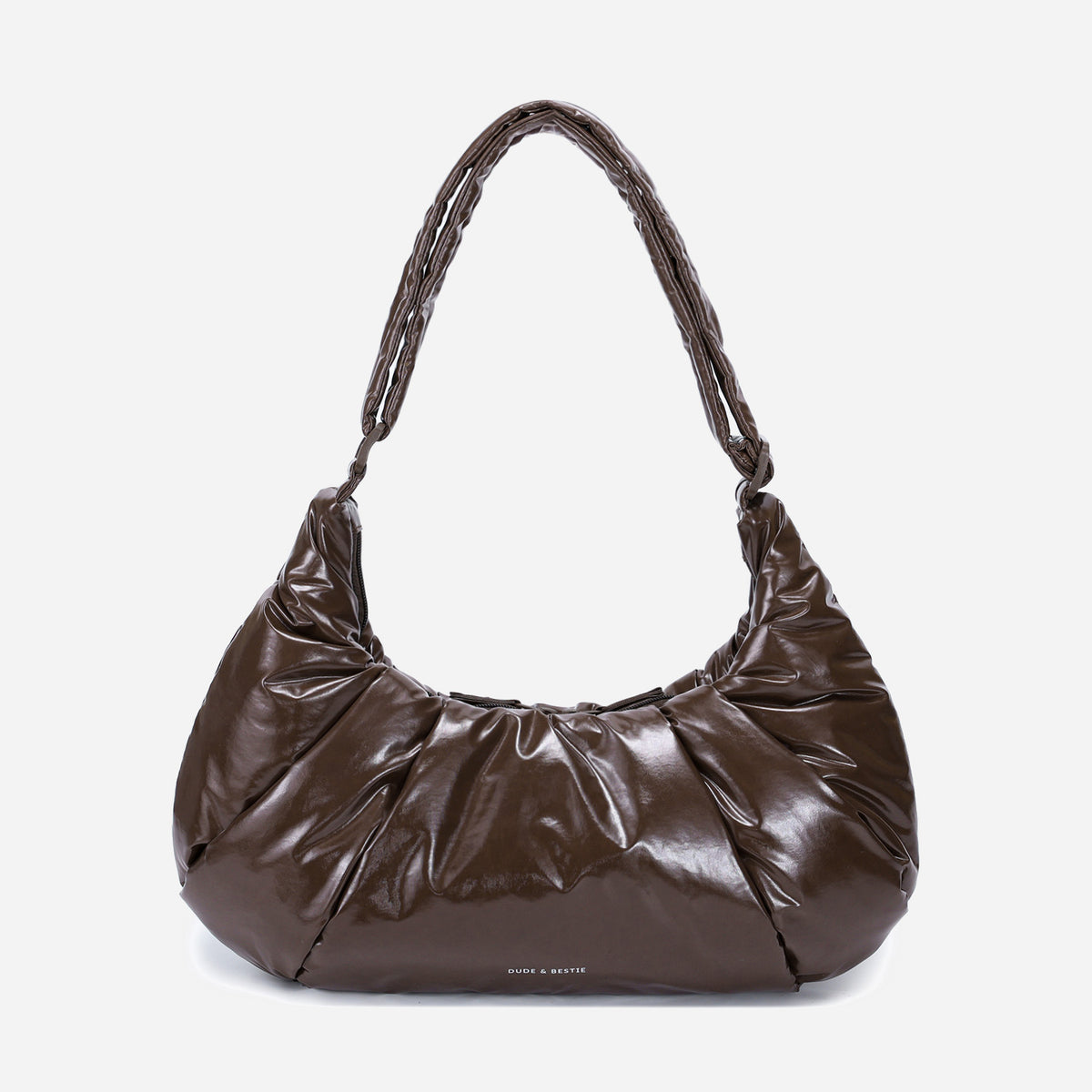 A glossy texture Croissant-shaped shoulder bag in glossy brown color by Dude & Bestie