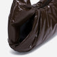 A glossy texture Croissant-shaped shoulder bag in glossy brown color by Dude & Bestie