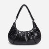 A black shiny Croissant-shaped shoulder bag with a single strap in polish black color