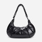A black shiny Croissant-shaped shoulder bag with a single strap in polish black color