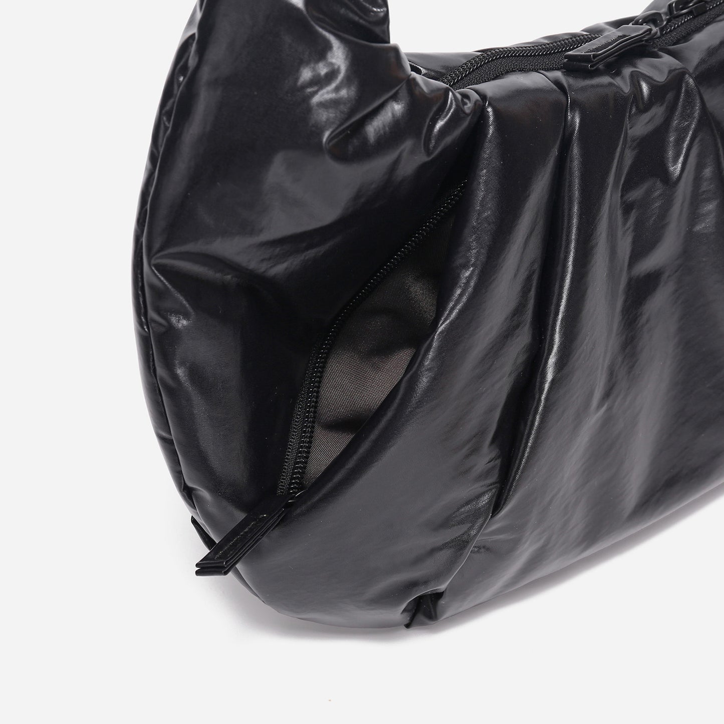 A black shiny Croissant-shaped shoulder bag with a single strap in polish black color