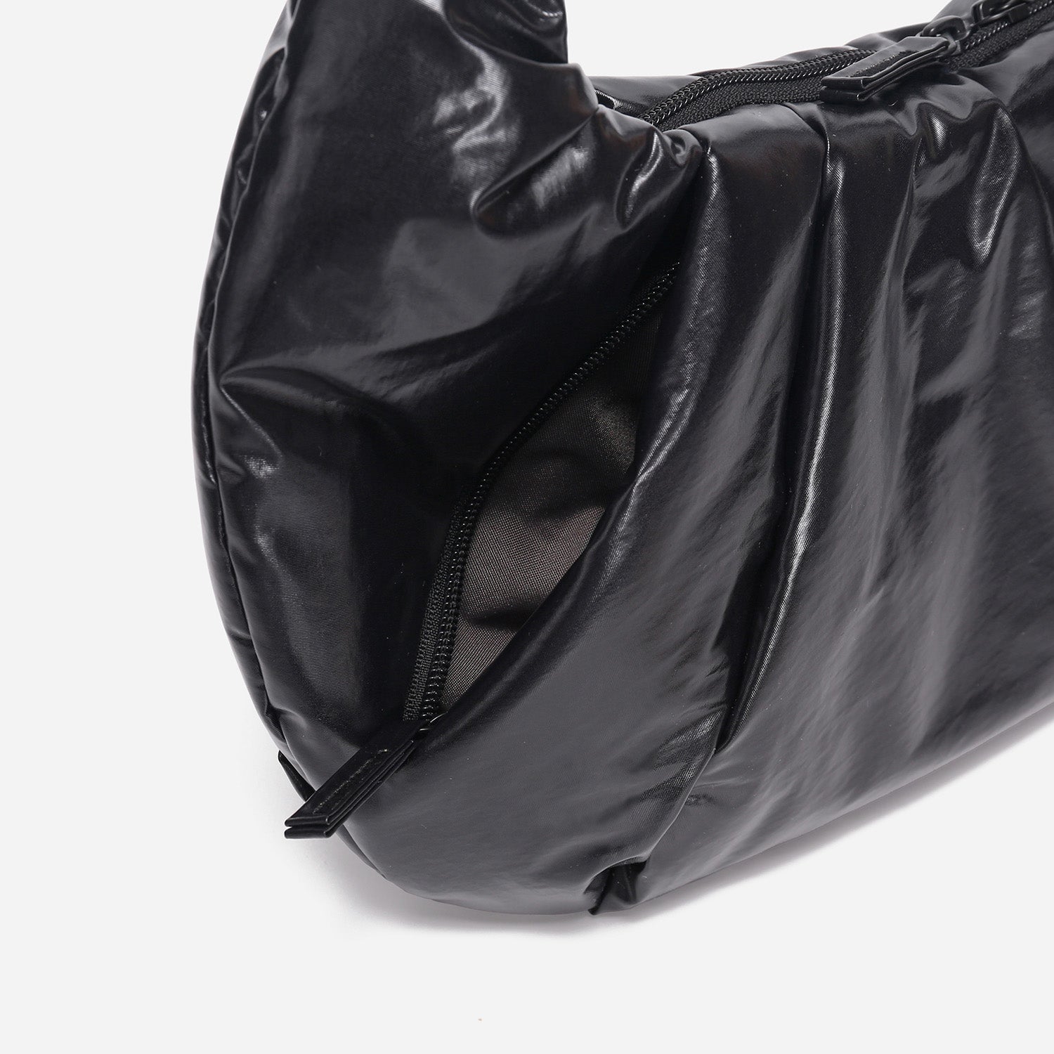 A black shiny Croissant-shaped shoulder bag with a single strap in polish black color