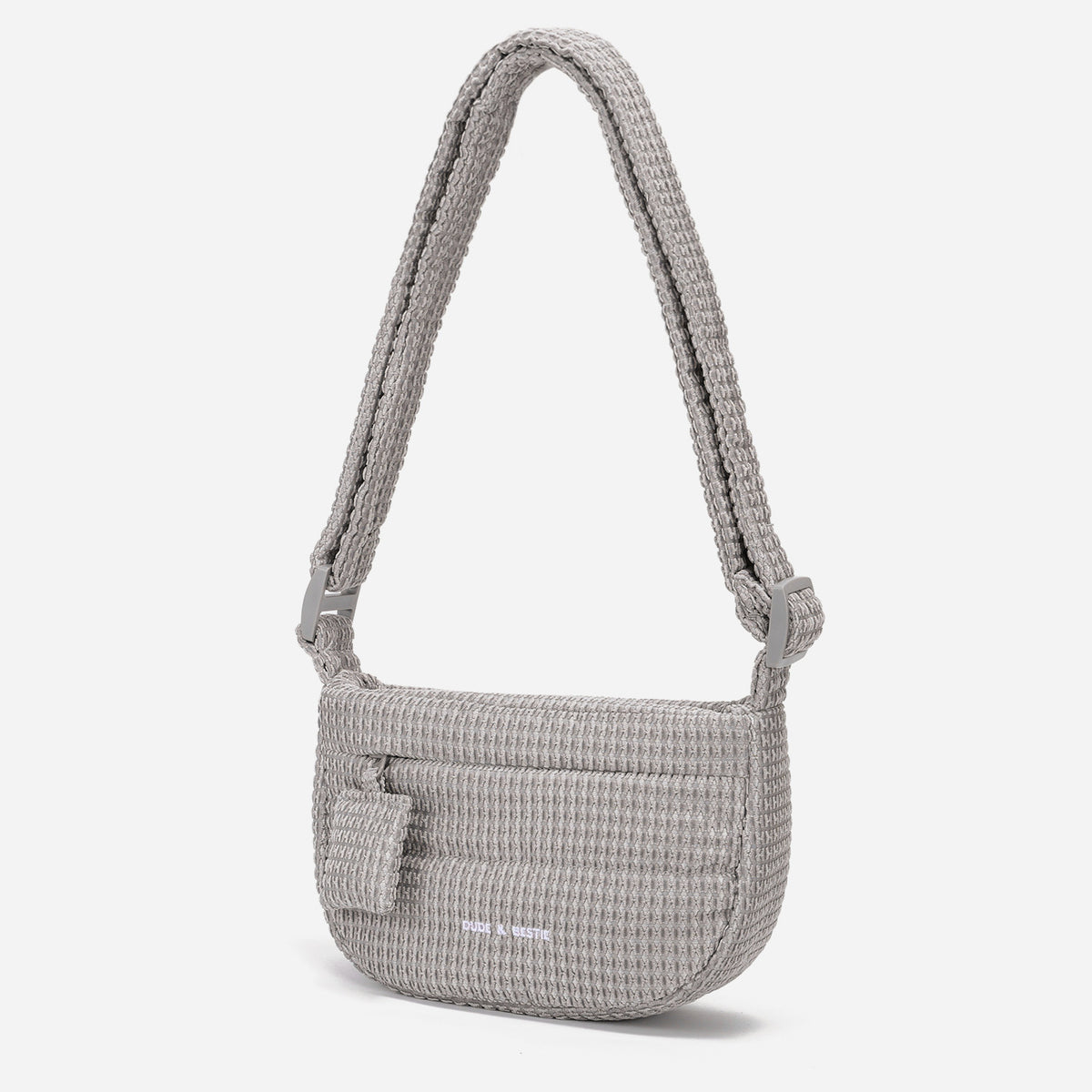 A light dove gray woven corduroy shoulder bag by Dude & Bestie Winter 2026 Series